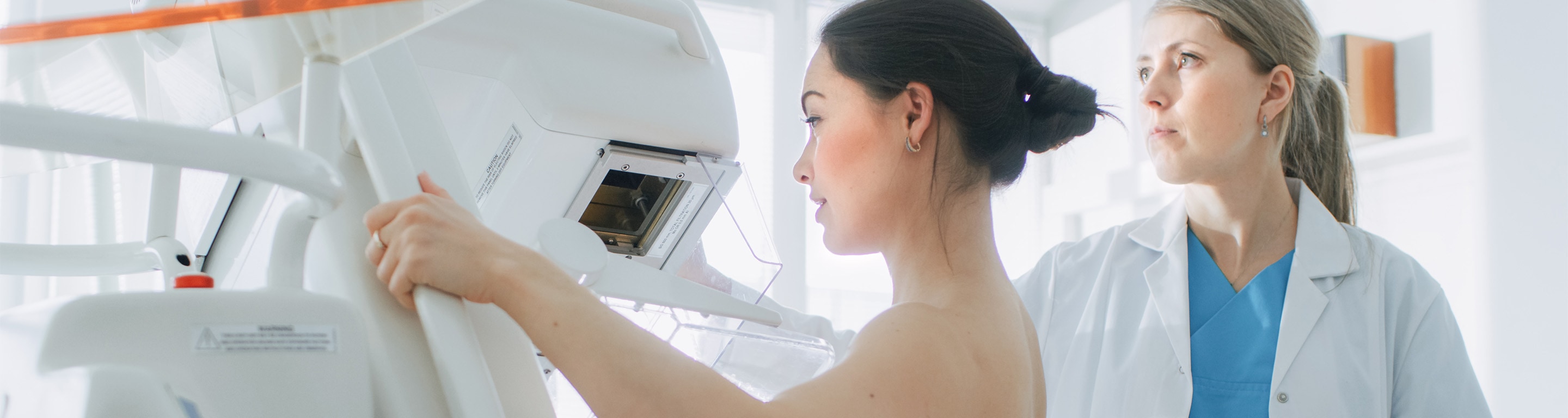 woman getting mammogram - breast health services Axia Women's Health